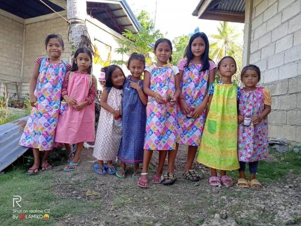 Young girls from the Philippines were very pleased to receive dresses and dolls from Ct. St. Augustine's Catholic Daughters.